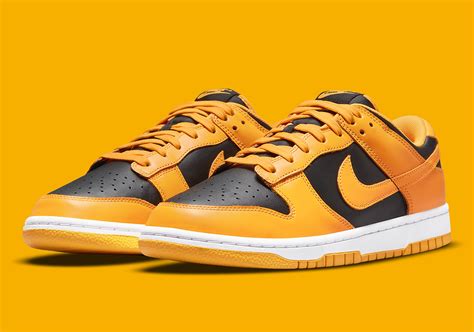 nike dunks goldenrod|yellow and black dunks low.